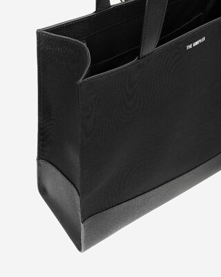 Black canvas and grained leather tote bag