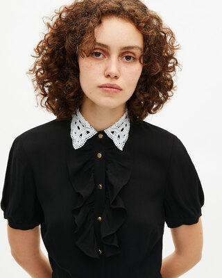 Short black dress with contrasting embroidered collar