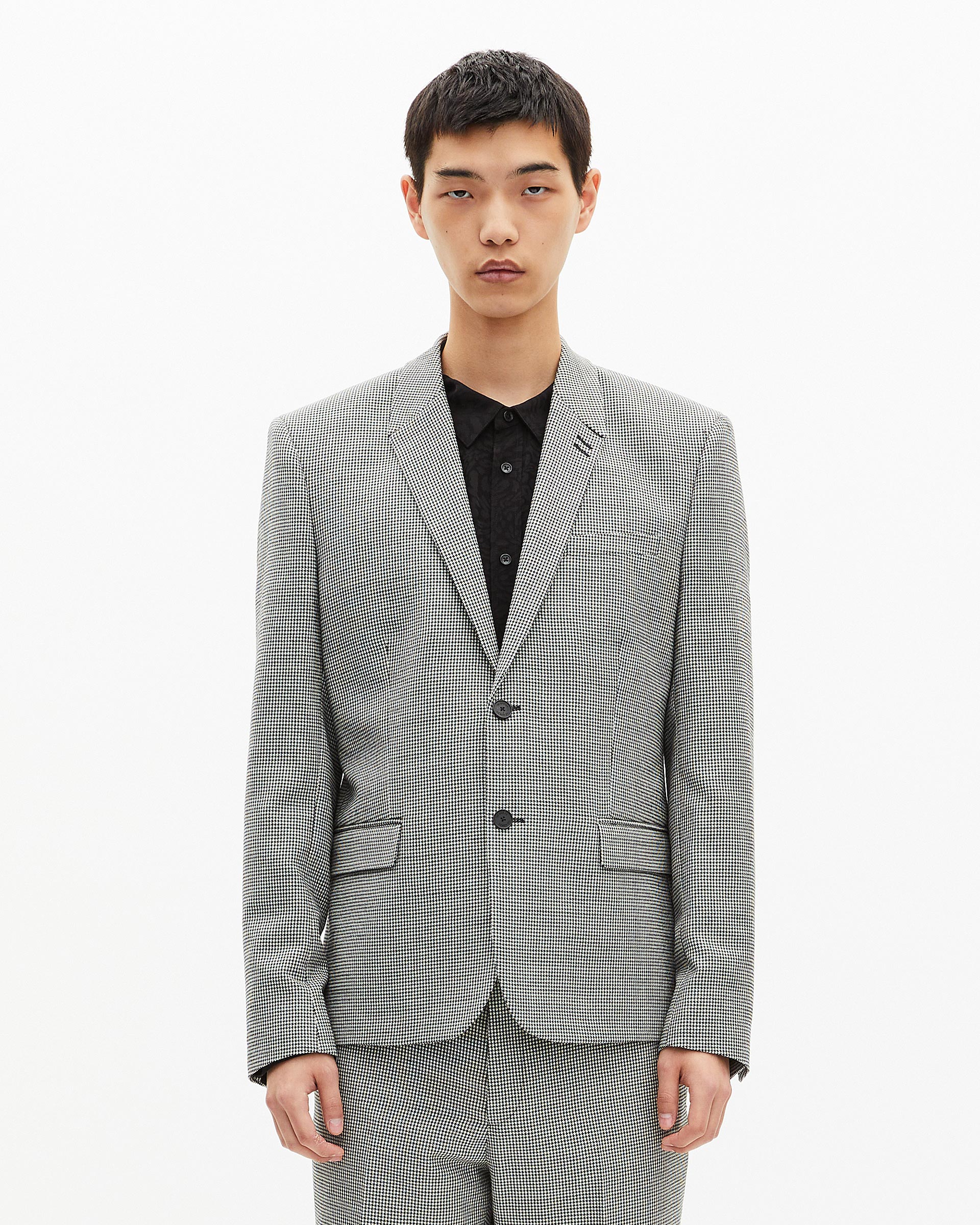 Black and white houndstooth suit jacket