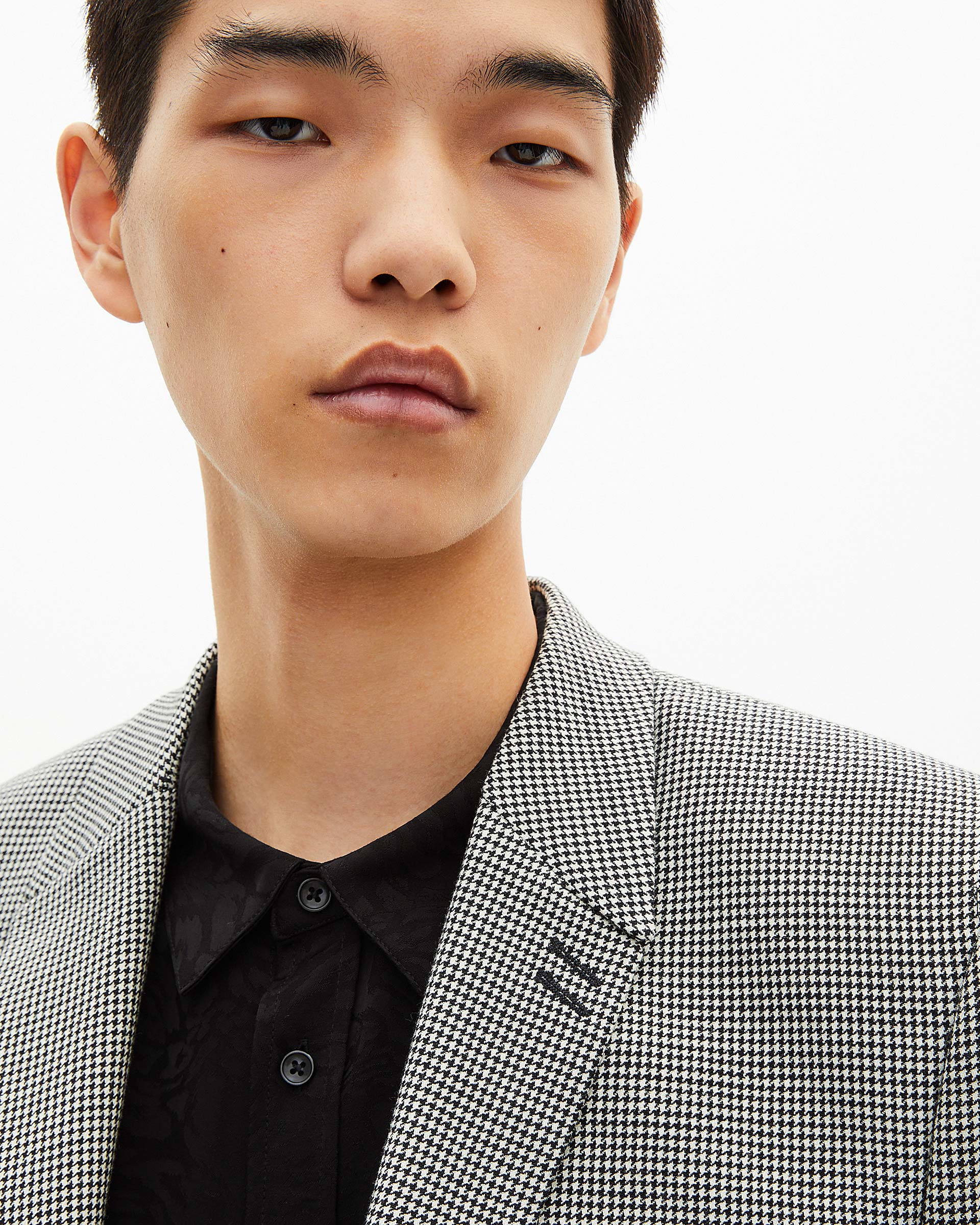 Black and white houndstooth suit jacket