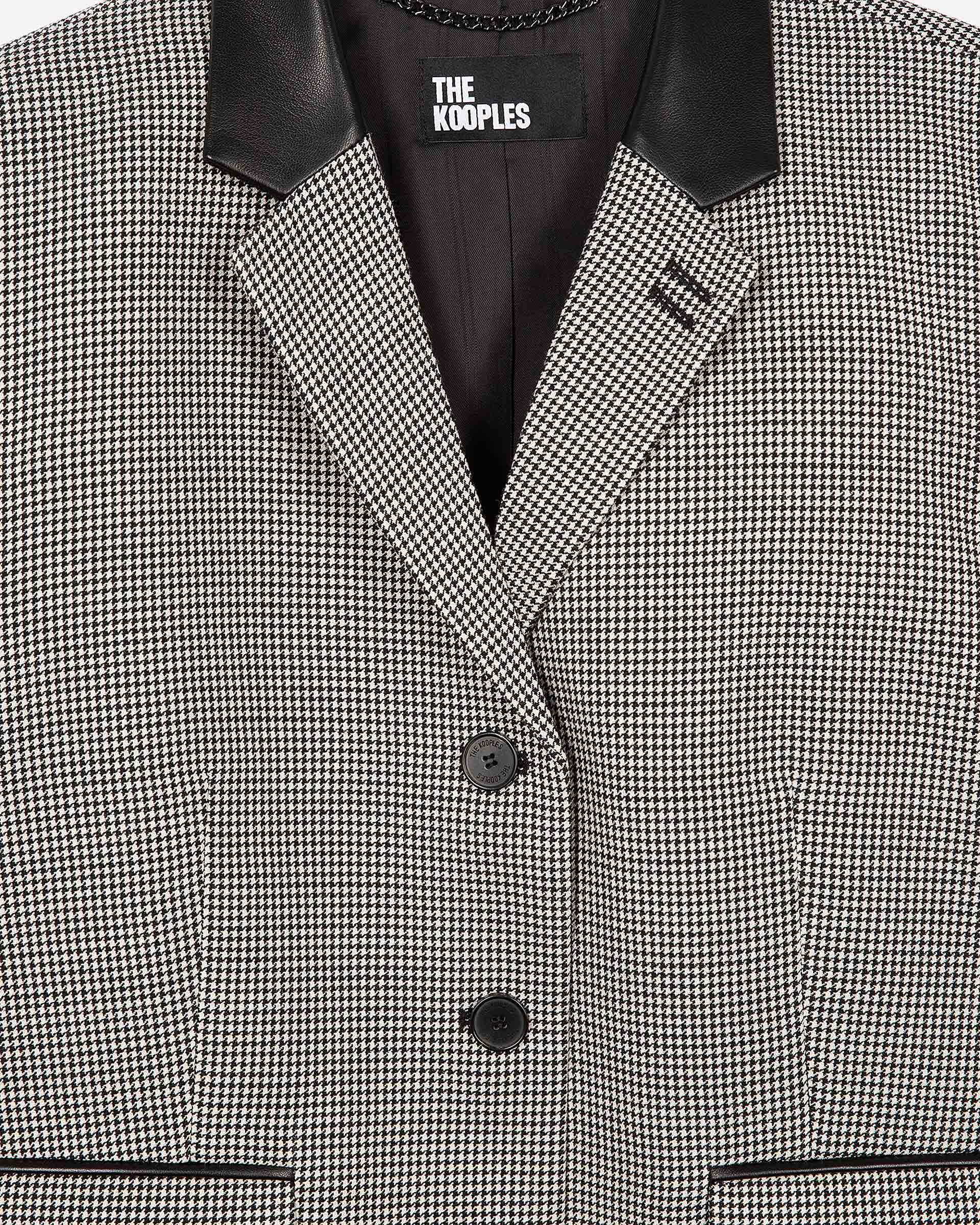 Short black and white houndstooth tailored jacket