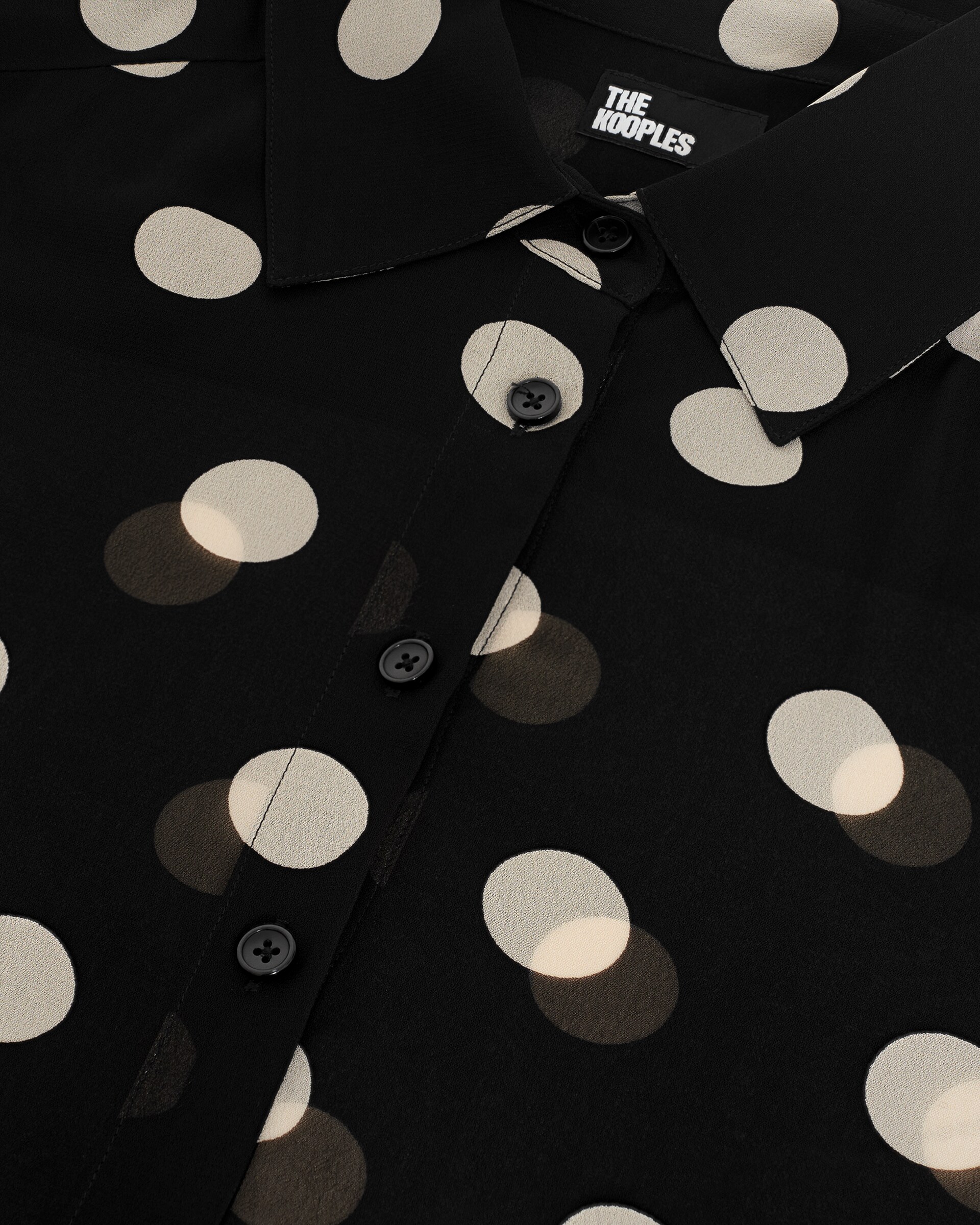 Black polka-dot shirt