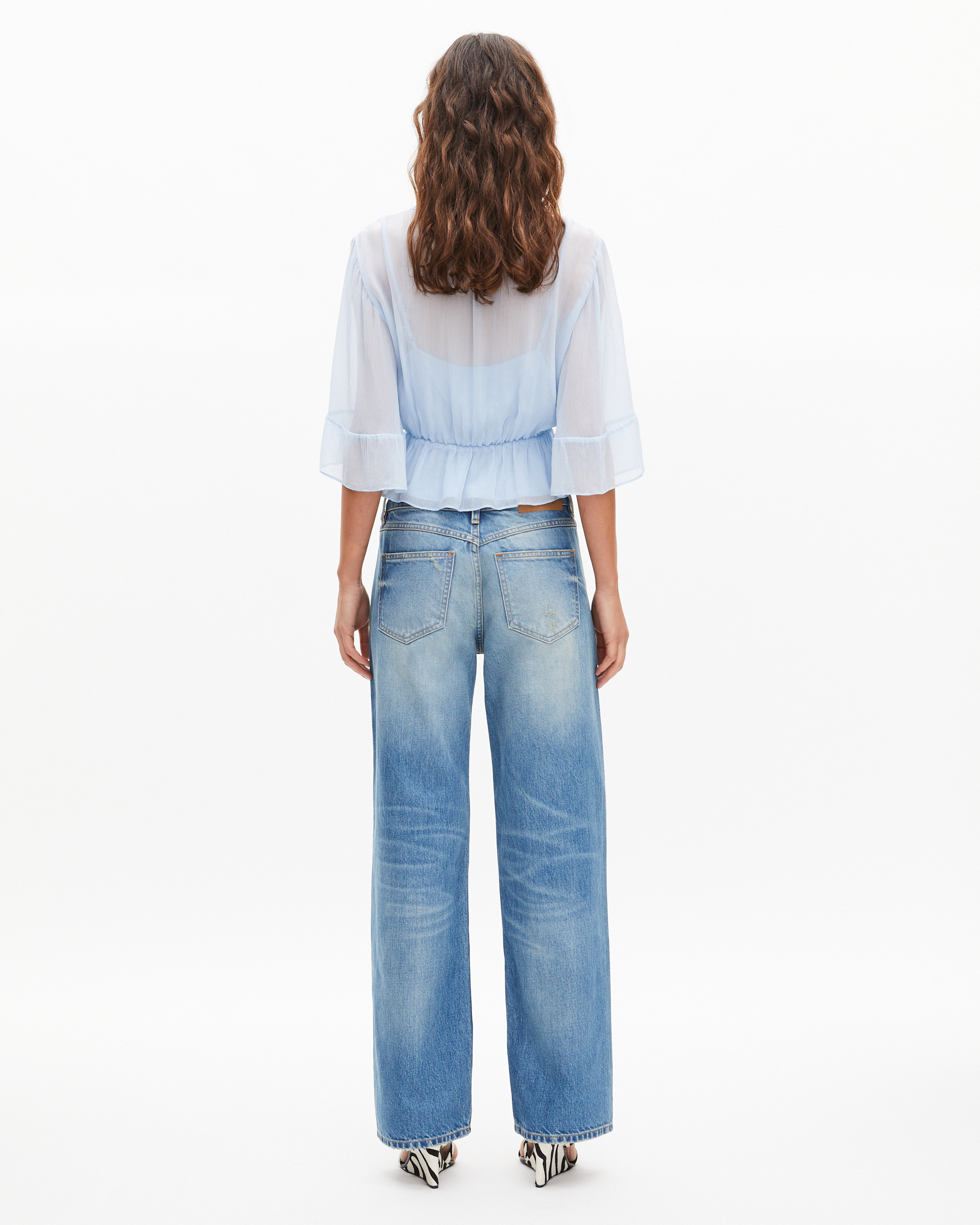 Blue ruffled blouse