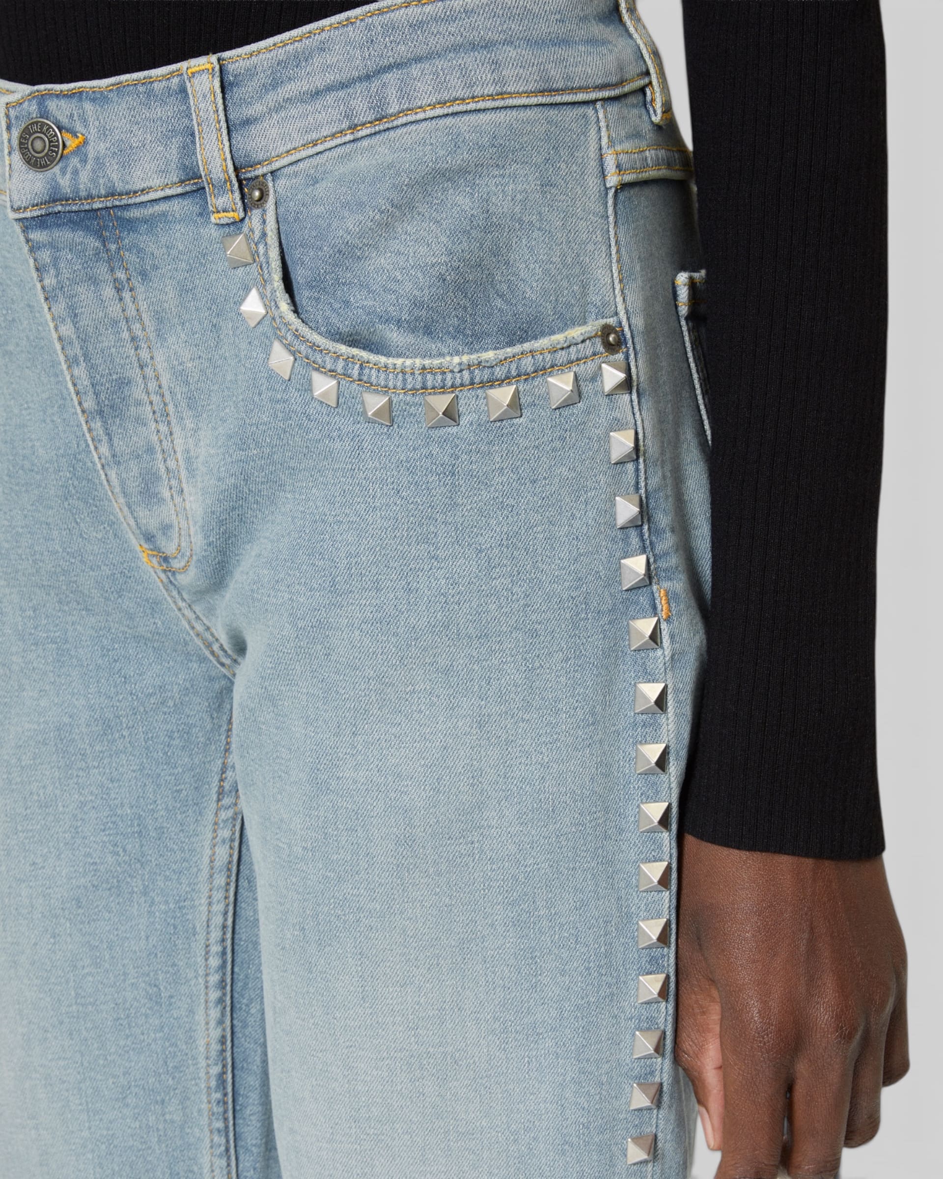 Long slim jeans with blue studs