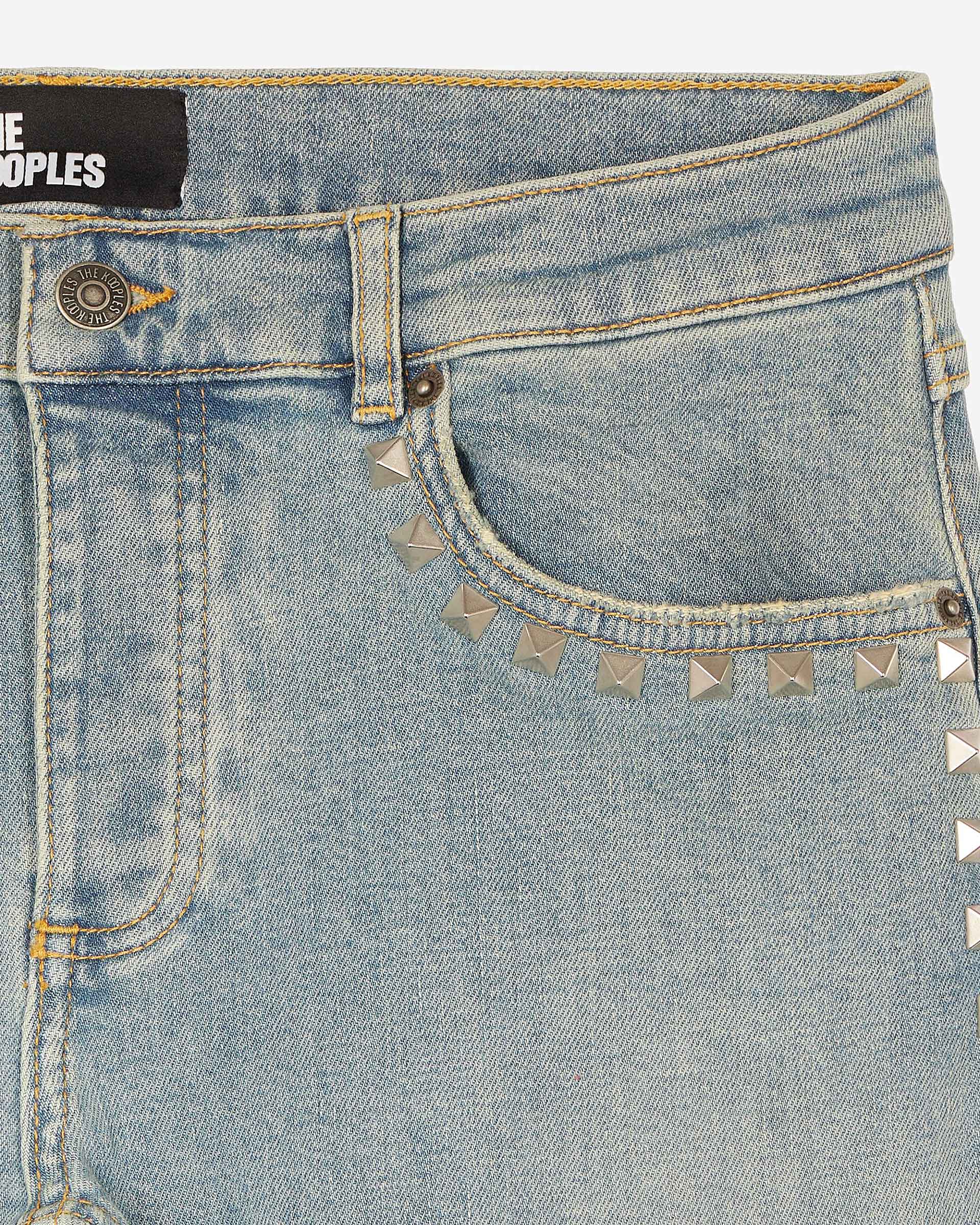 Long slim jeans with blue studs