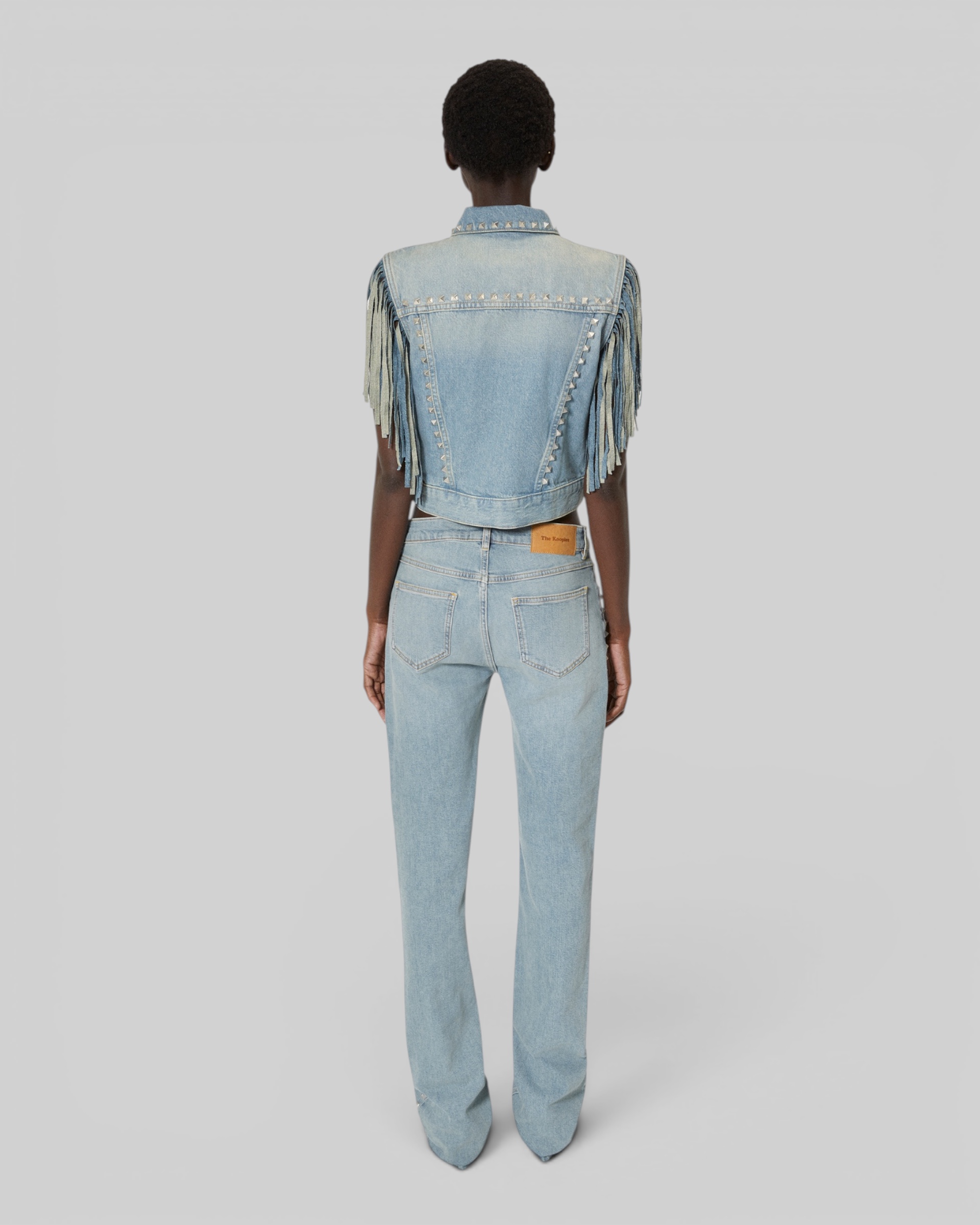 Blue denim jacket with bangs and studs