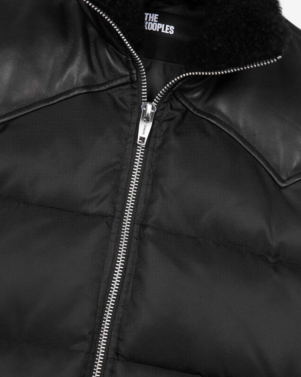 Sleeveless padded jacket with black fur collar