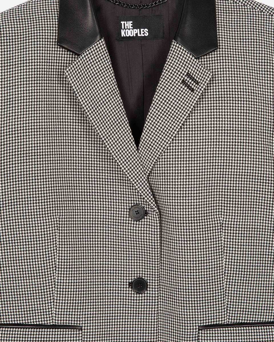 Short black and white houndstooth tailored jacket