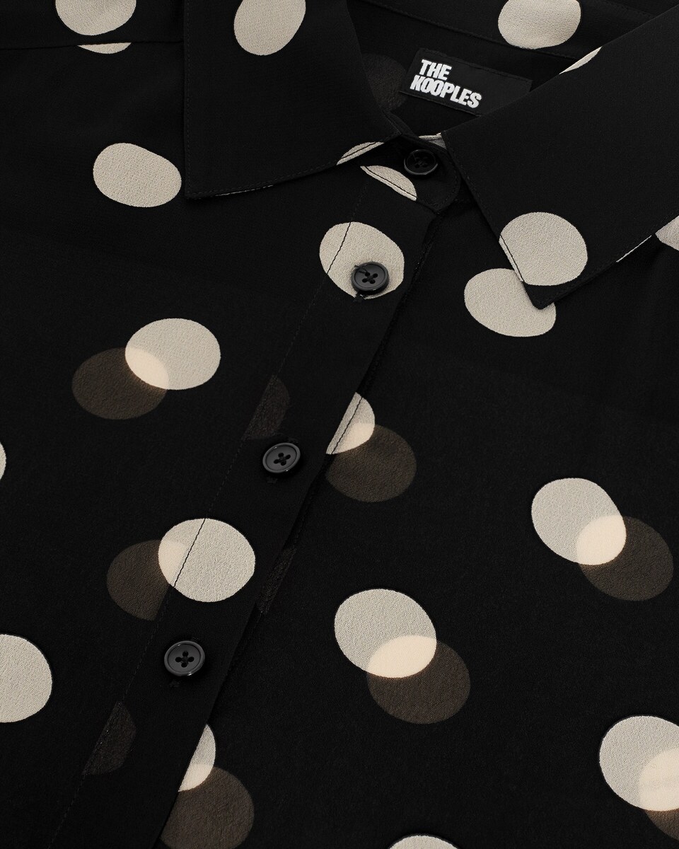 Black polka-dot shirt