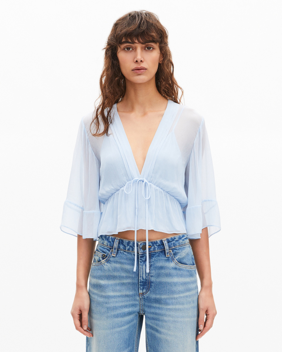 Blue ruffled blouse