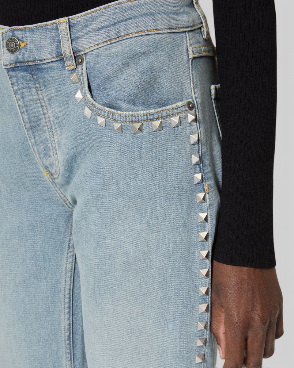 Long slim jeans with blue studs