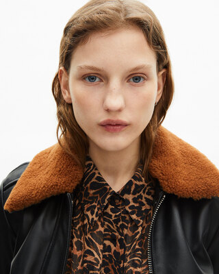 Short black smooth leather jacket with sherpa collar