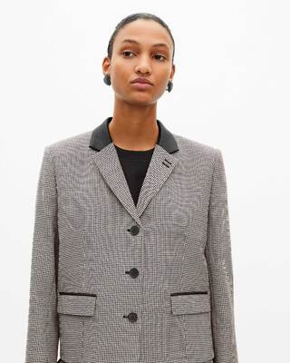 Short black and white houndstooth tailored jacket