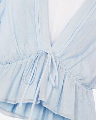 Blue ruffled blouse