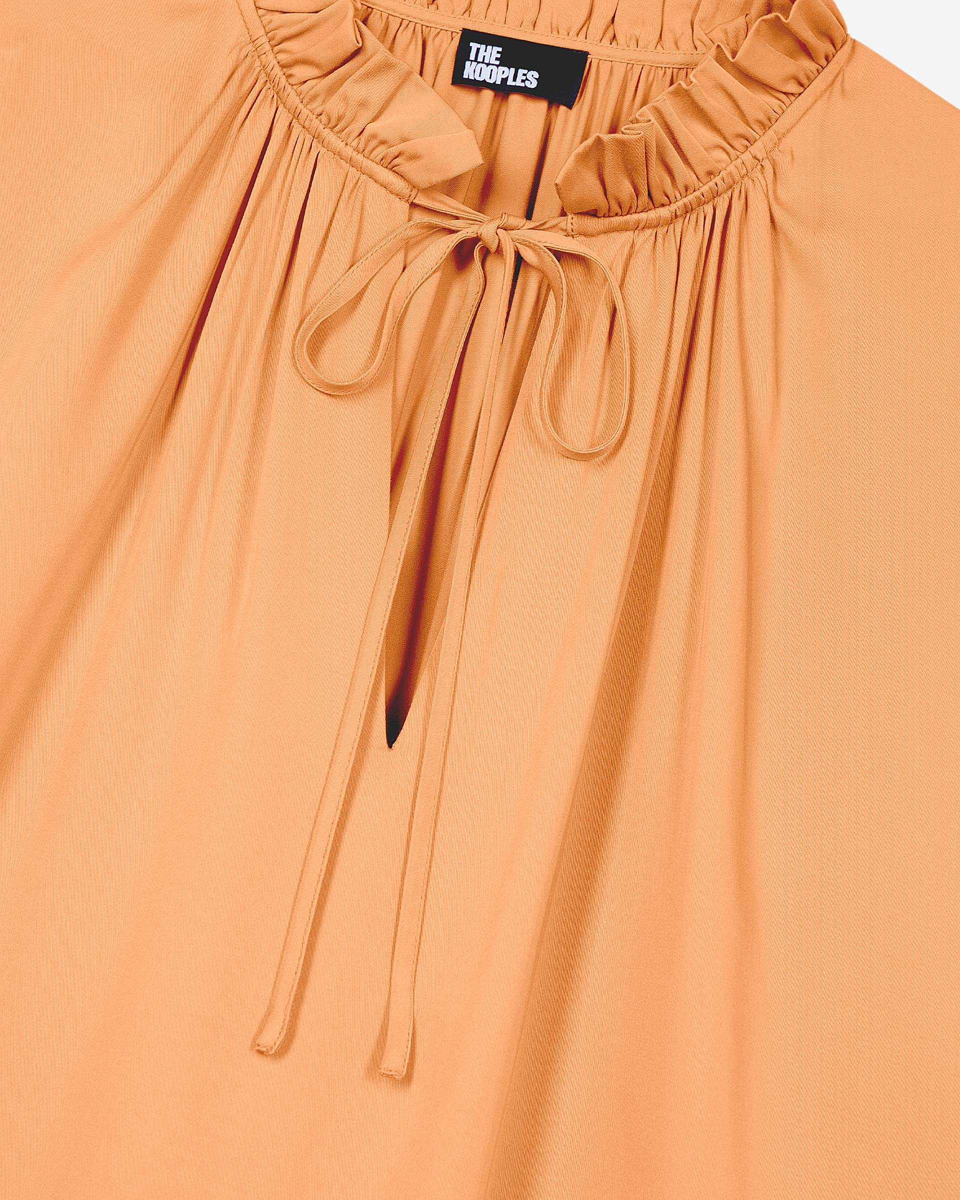 Blouse with dark orange ruffles