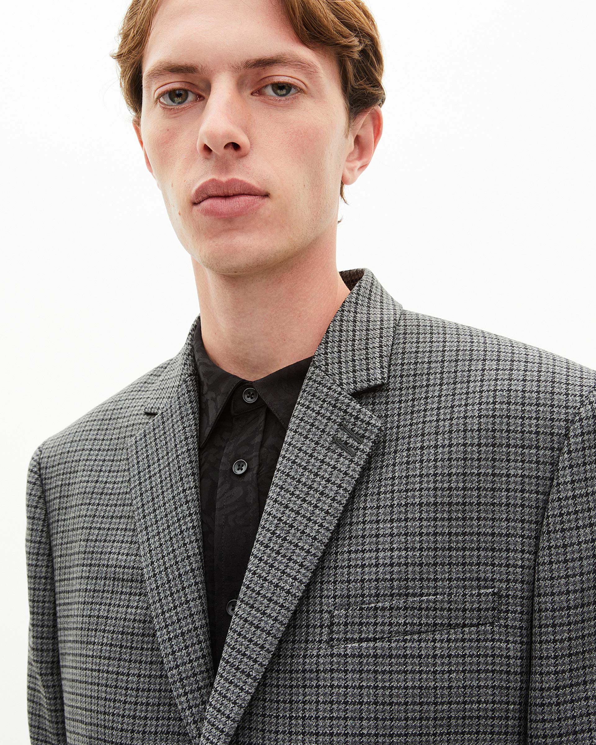 Black and grey houndstooth suit jacket