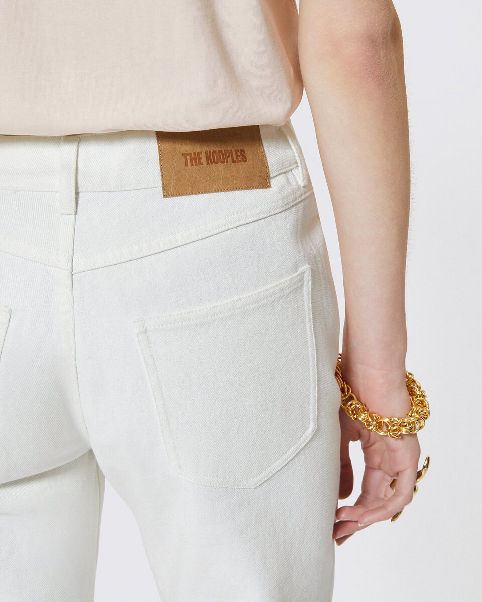 Off white coated straight jeans