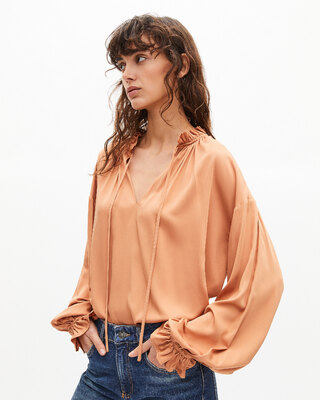 Blouse with dark orange ruffles