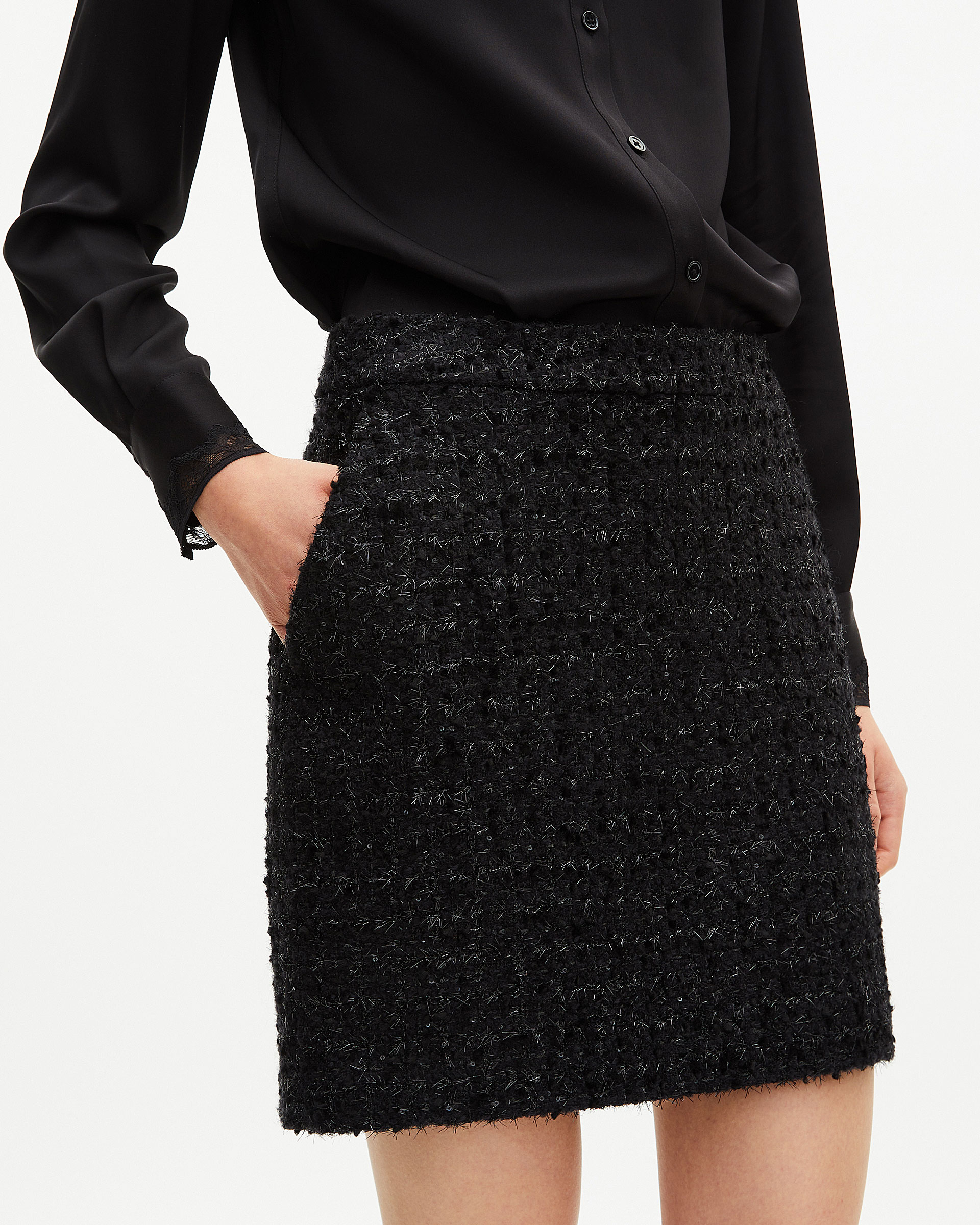 Short skirt in shiny black tweed