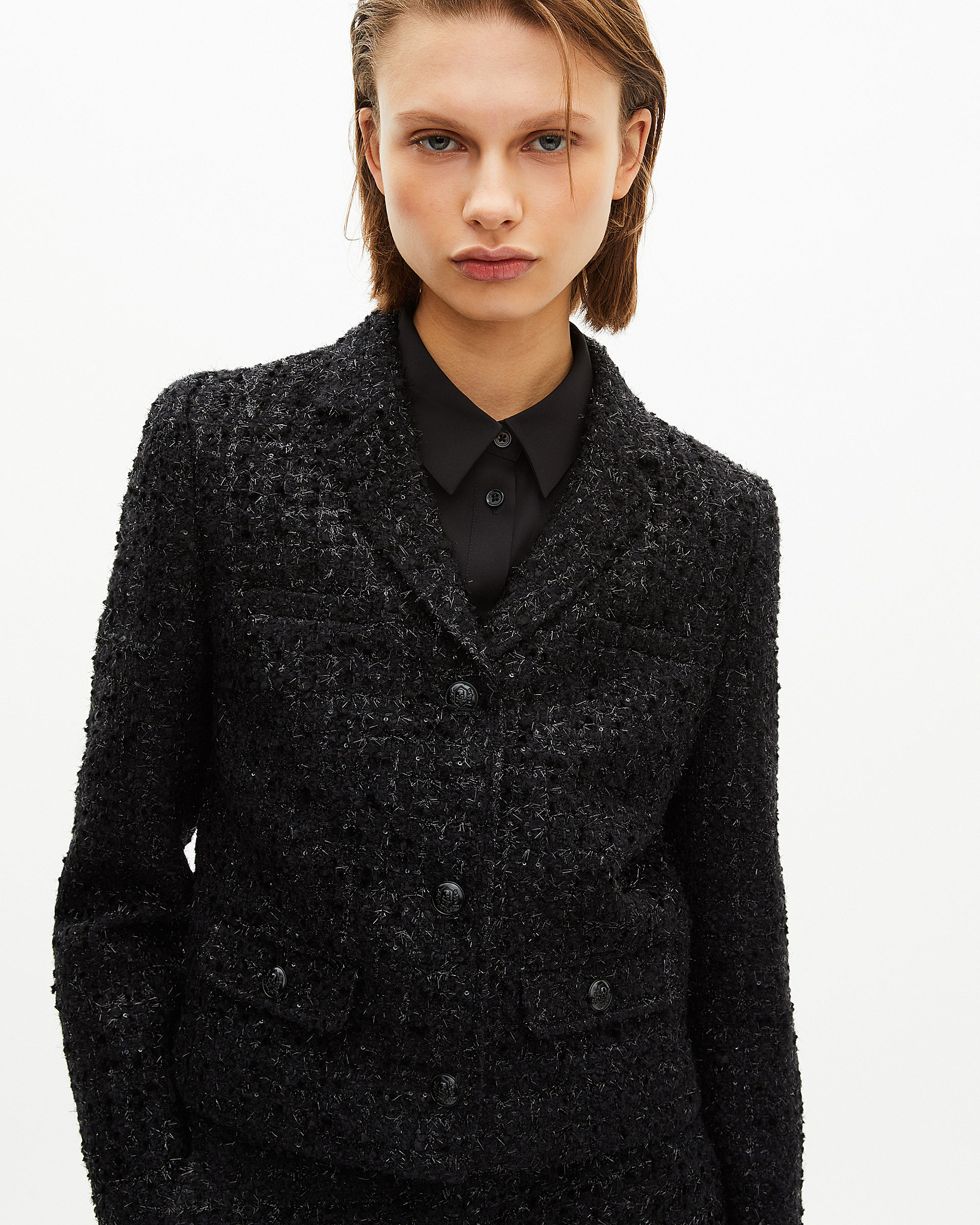 Short jacket in shiny black tweed