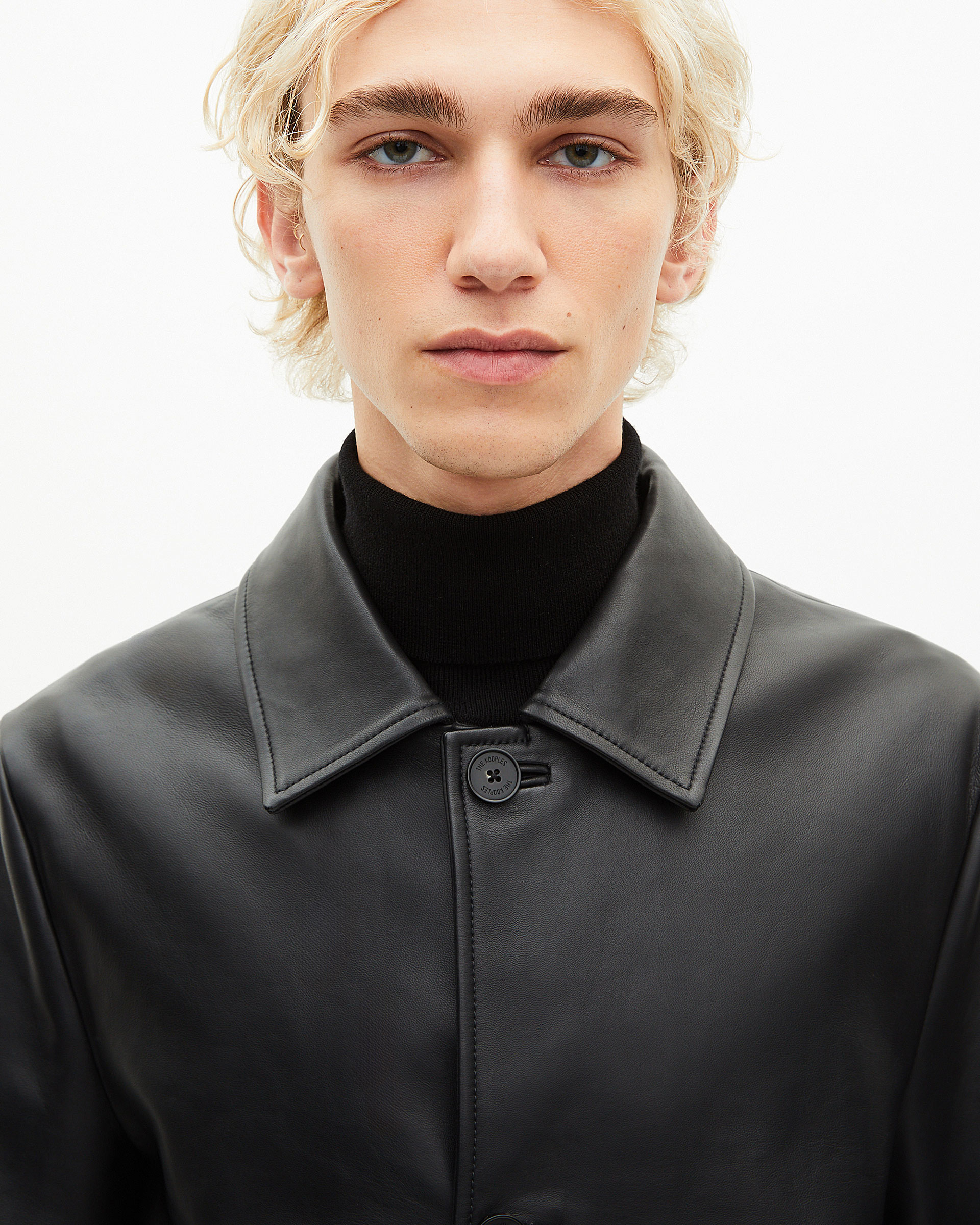 Black leather mid-length coat