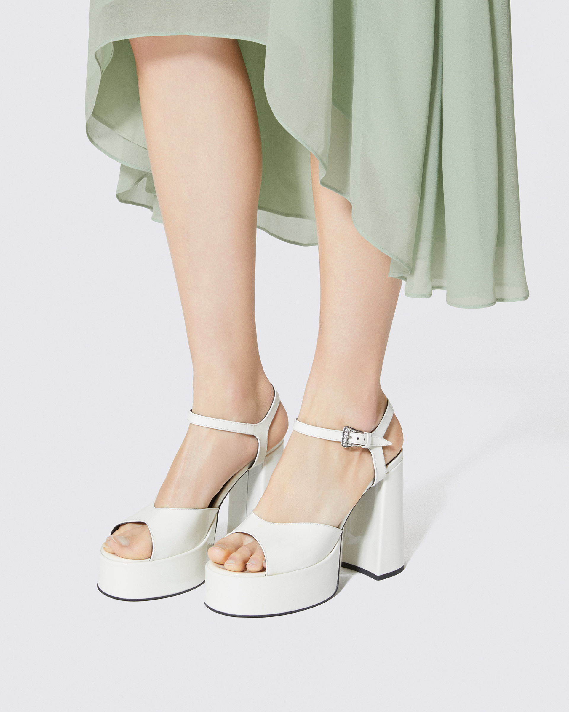 White patent leather heeled sandals