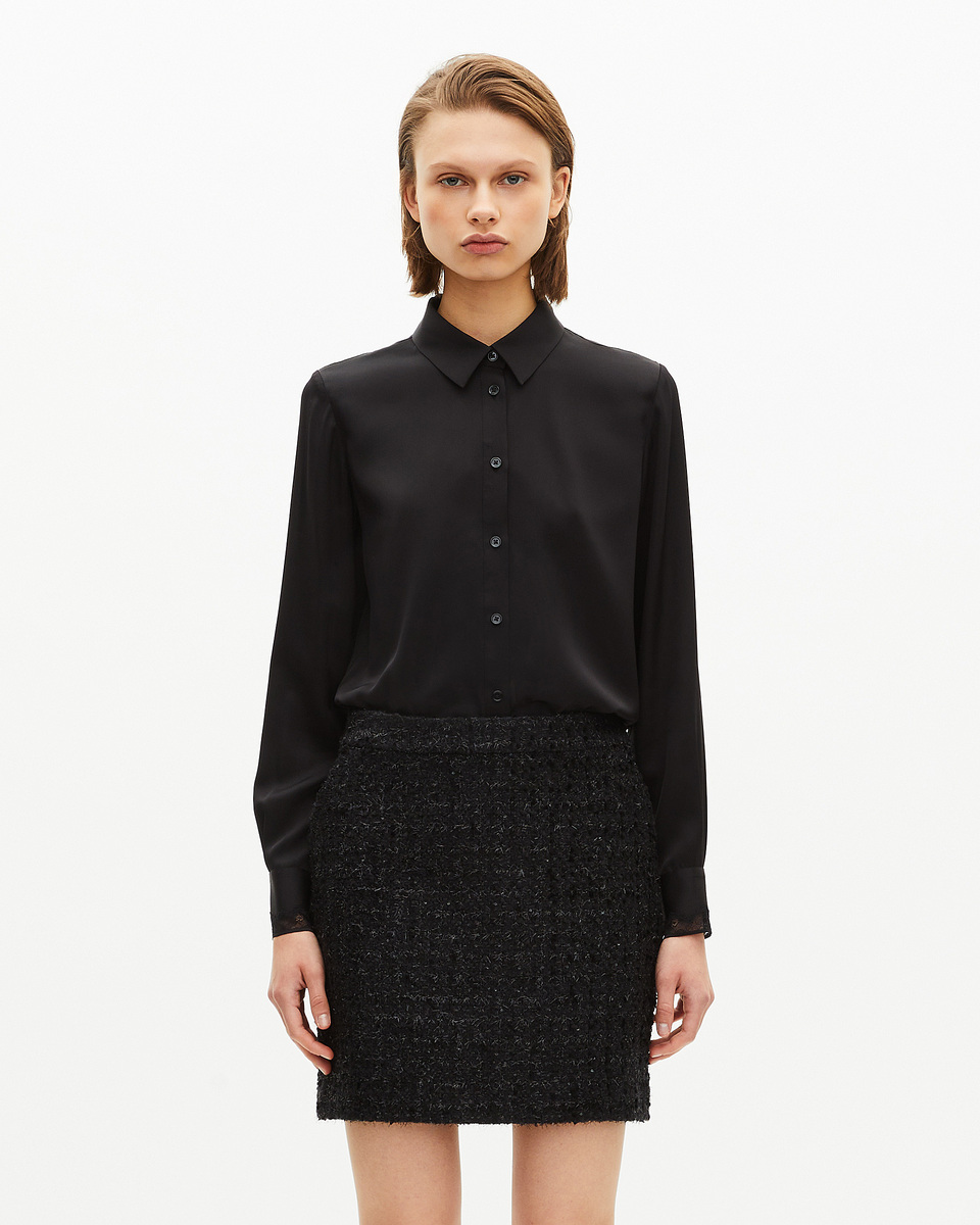Short skirt in shiny black tweed