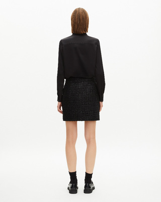 Short skirt in shiny black tweed