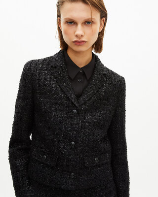 Short jacket in shiny black tweed
