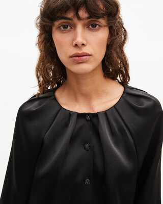 Short cape-effect jacket in black satin