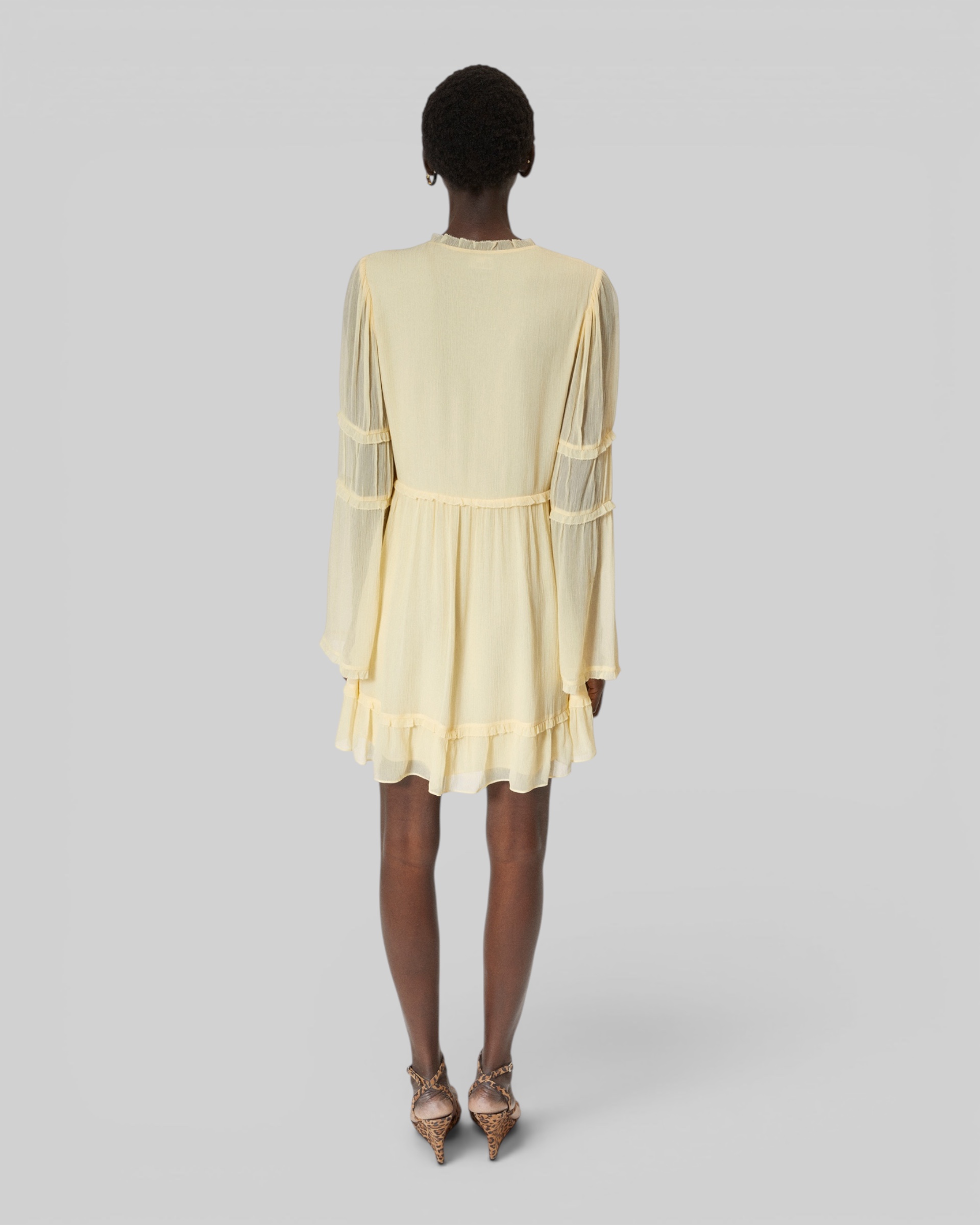 Short yellow ruffled dress