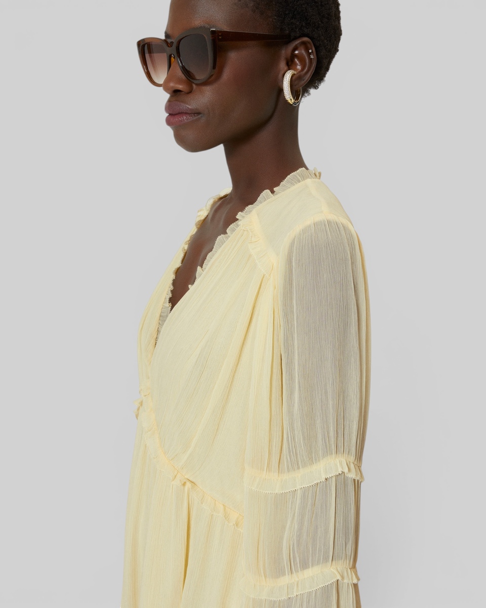 Short yellow ruffled dress