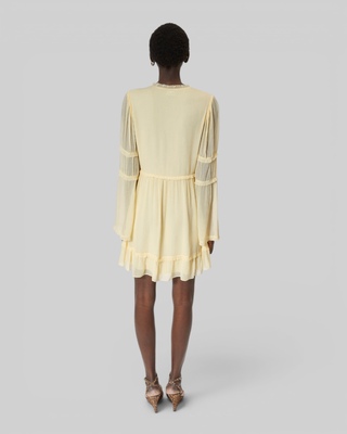 Short yellow ruffled dress