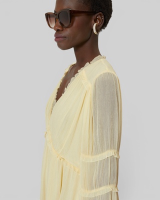 Short yellow ruffled dress