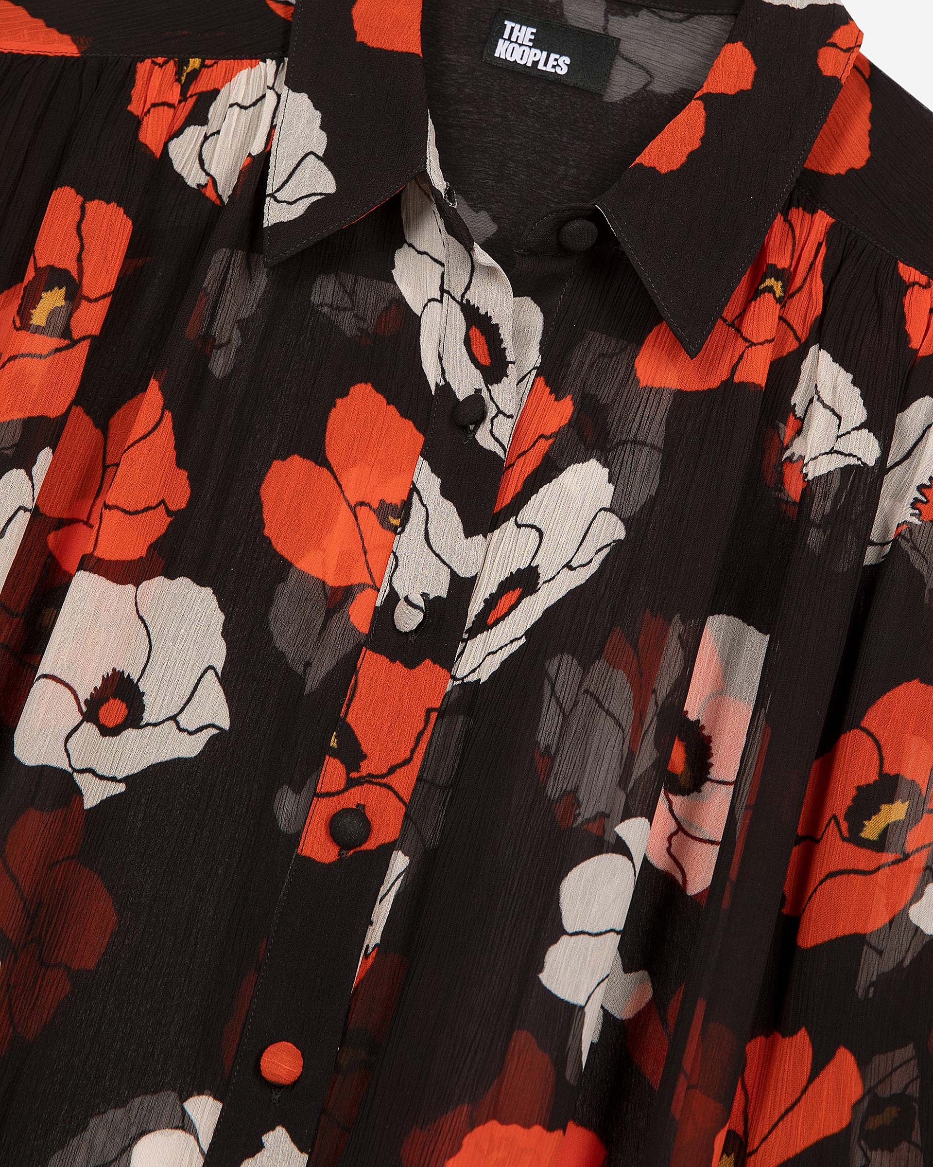 Loose-fitting black floral print shirt