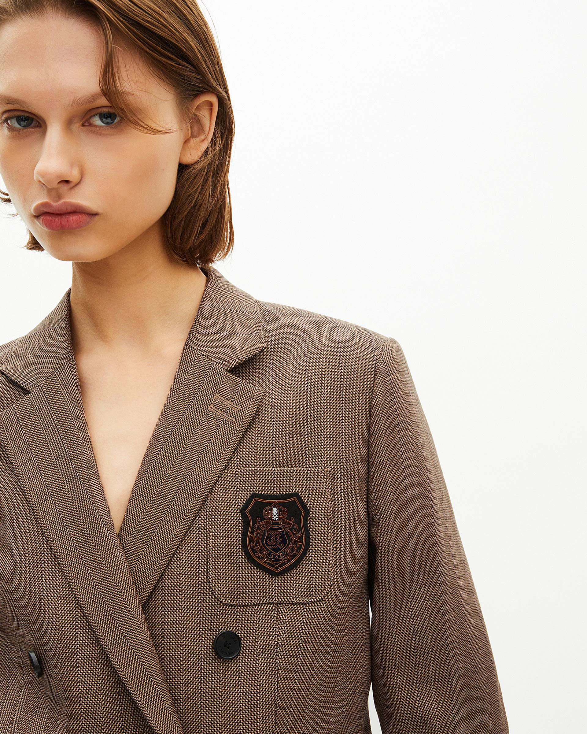 Double-breasted wool suit jacket with camel coat of arms