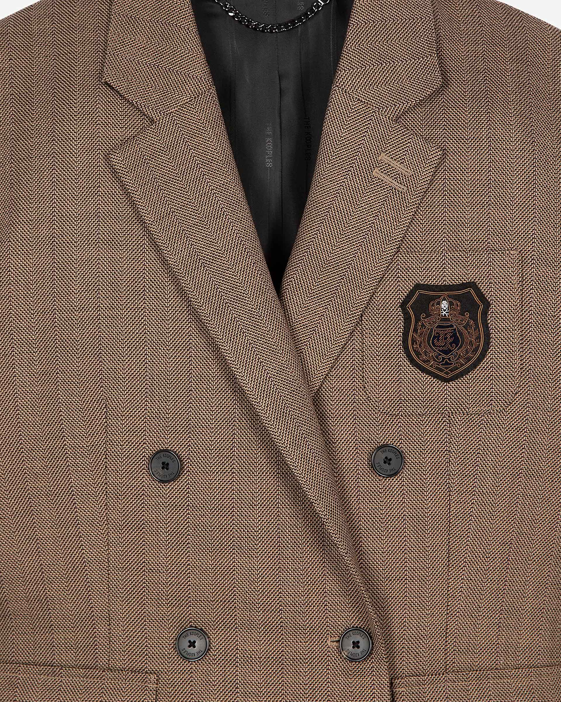 Double-breasted wool suit jacket with camel coat of arms
