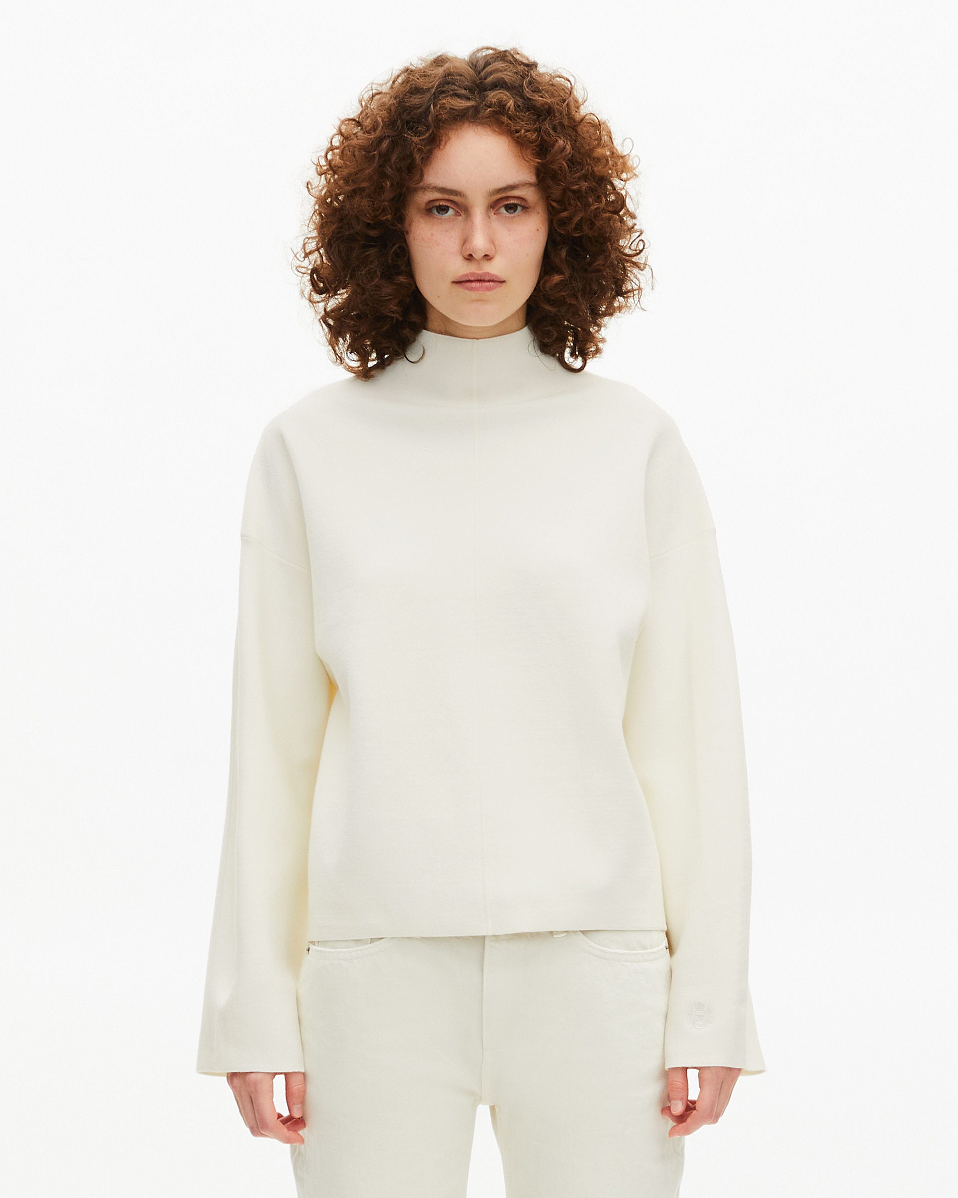 White mock-neck sweater
