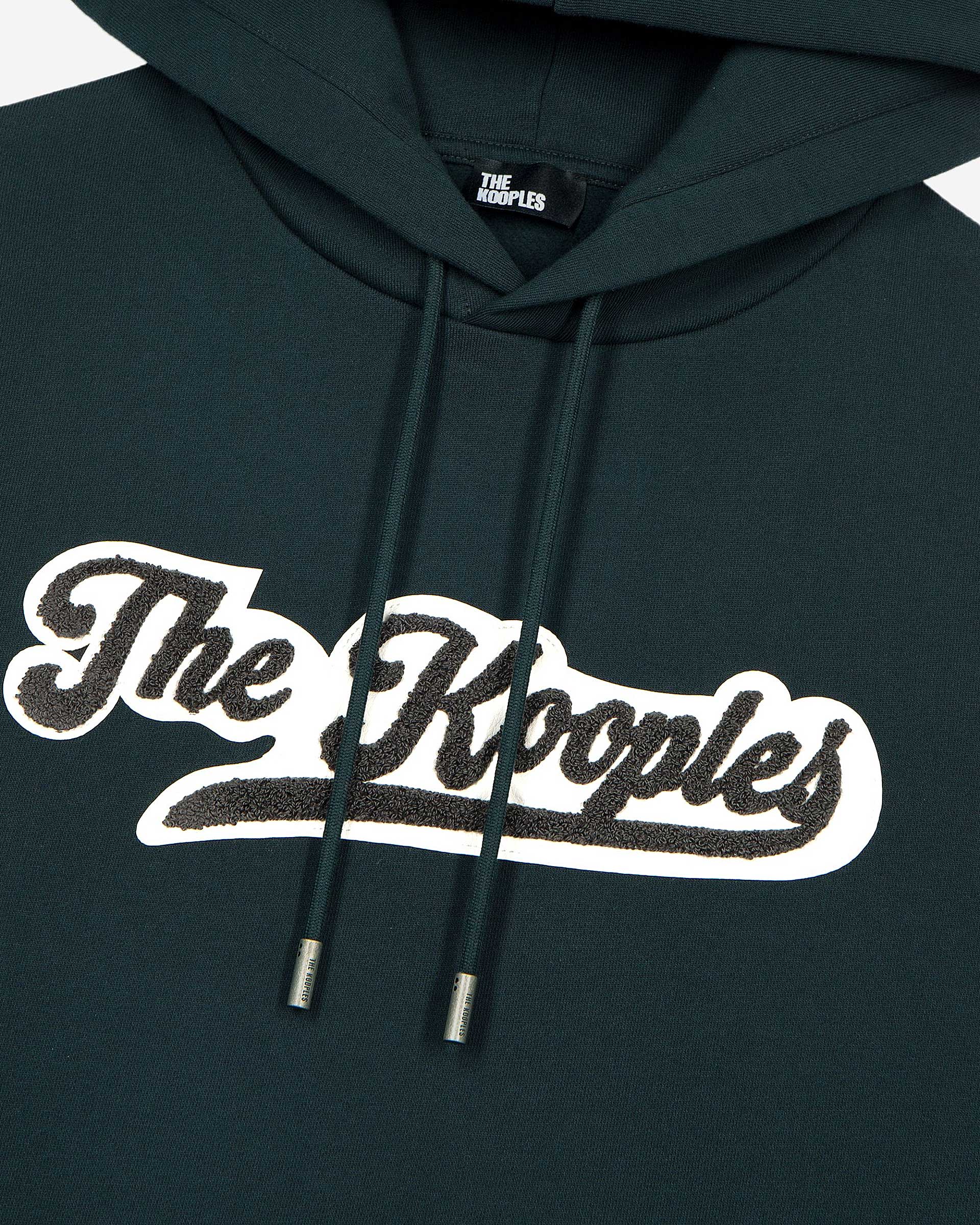Hooded sweatshirt with dark green patch