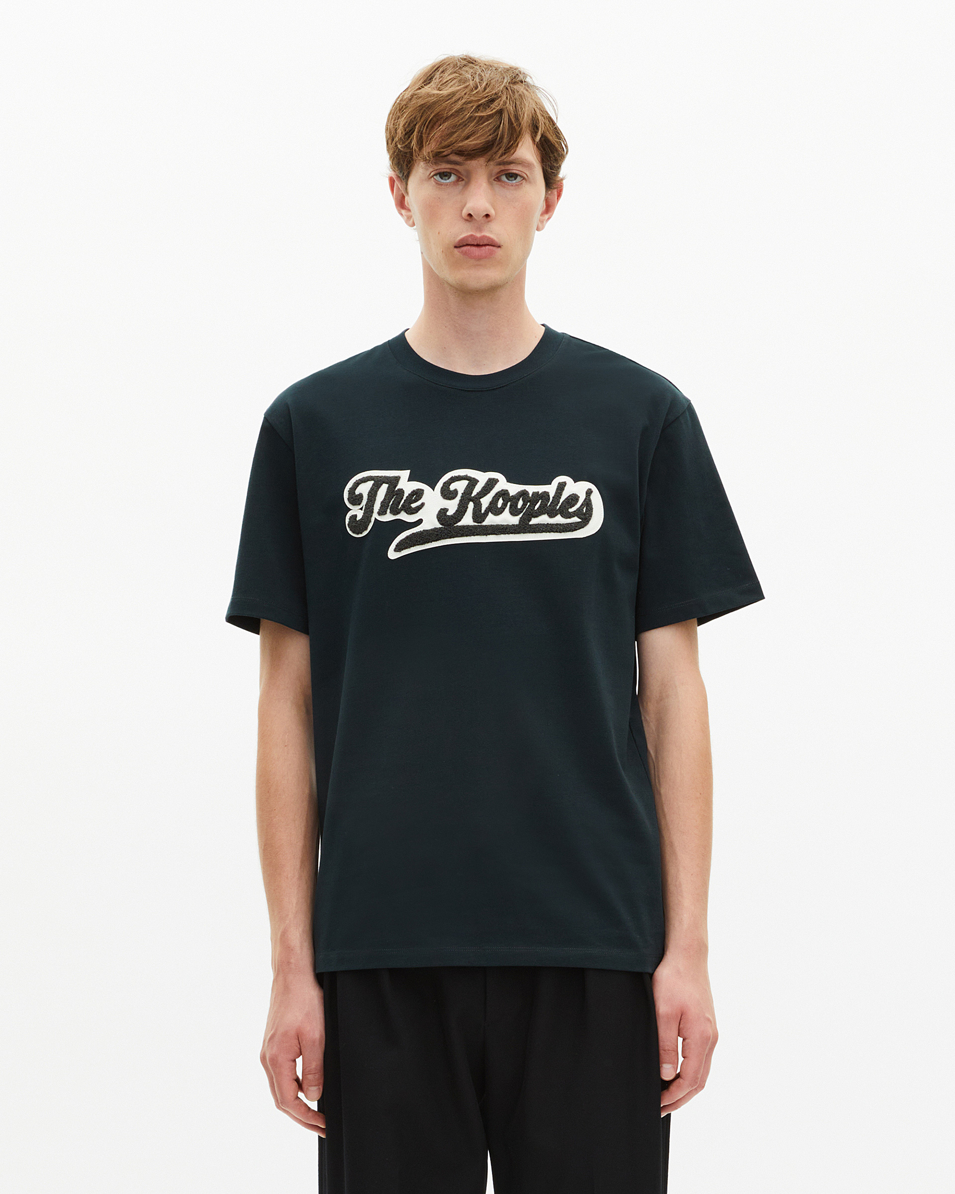 T-shirt with dark green patch