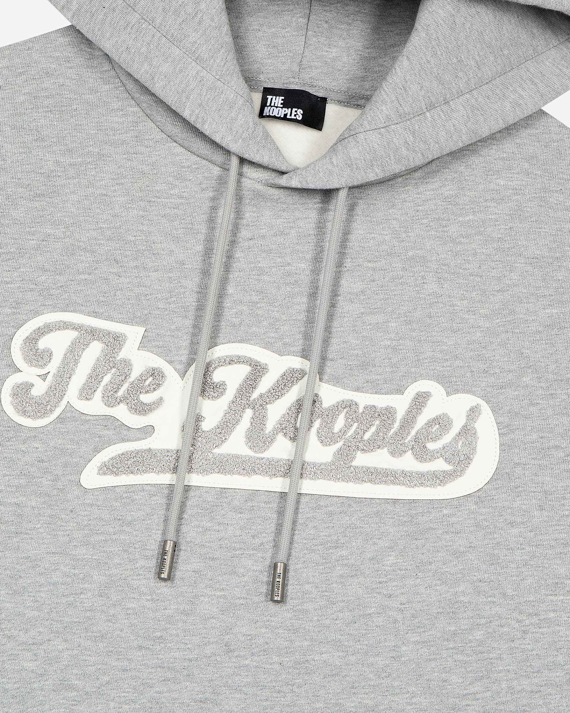 Hooded sweatshirt with grey patch
