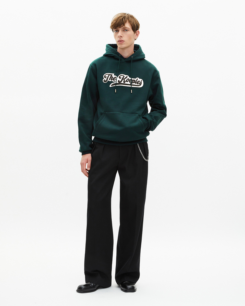 Hooded sweatshirt with dark green patch