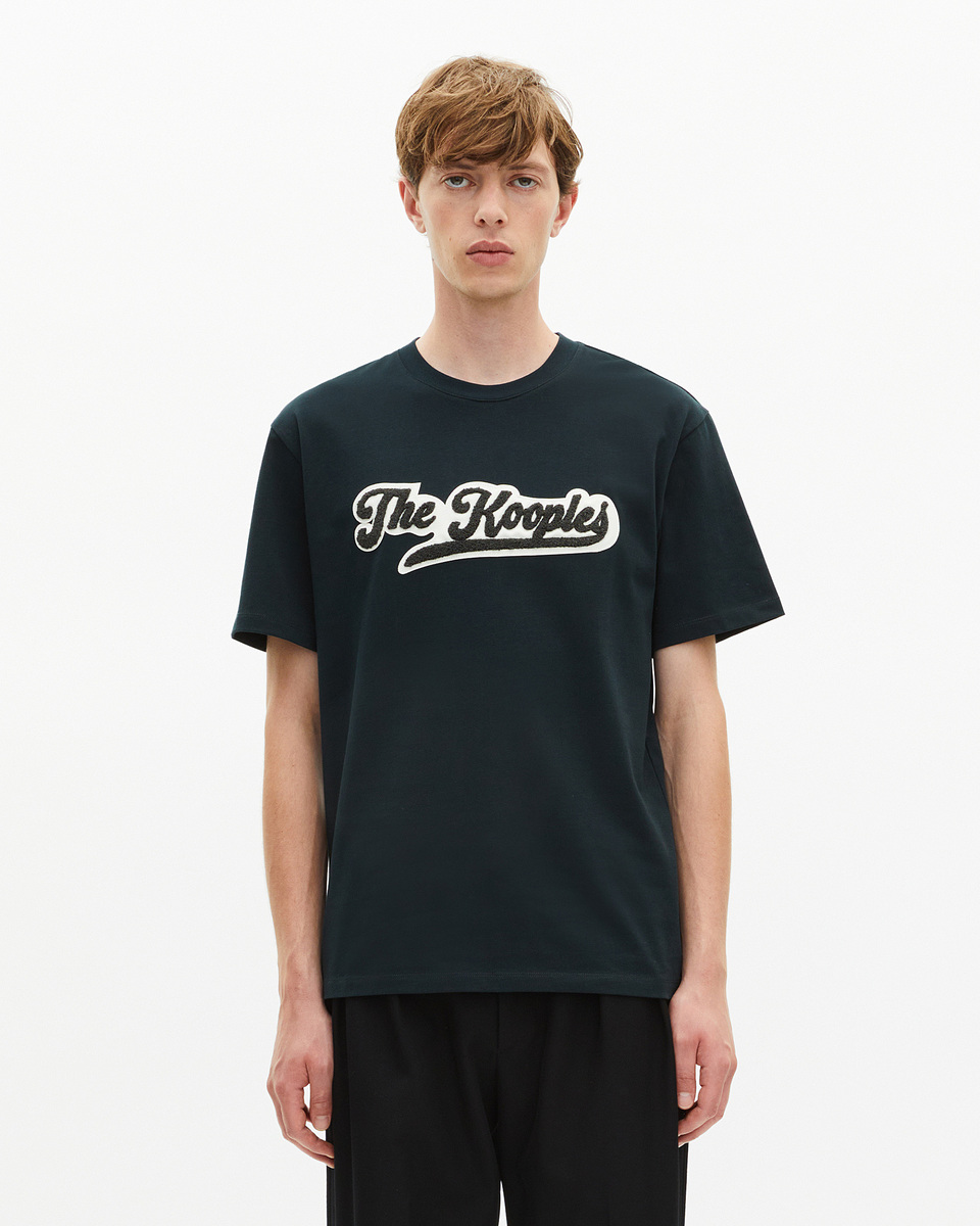 T-shirt with dark green patch