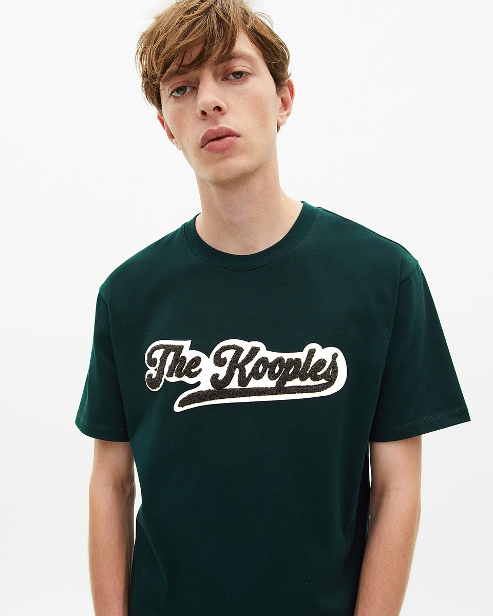T-shirt with dark green patch