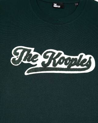 T-shirt with dark green patch