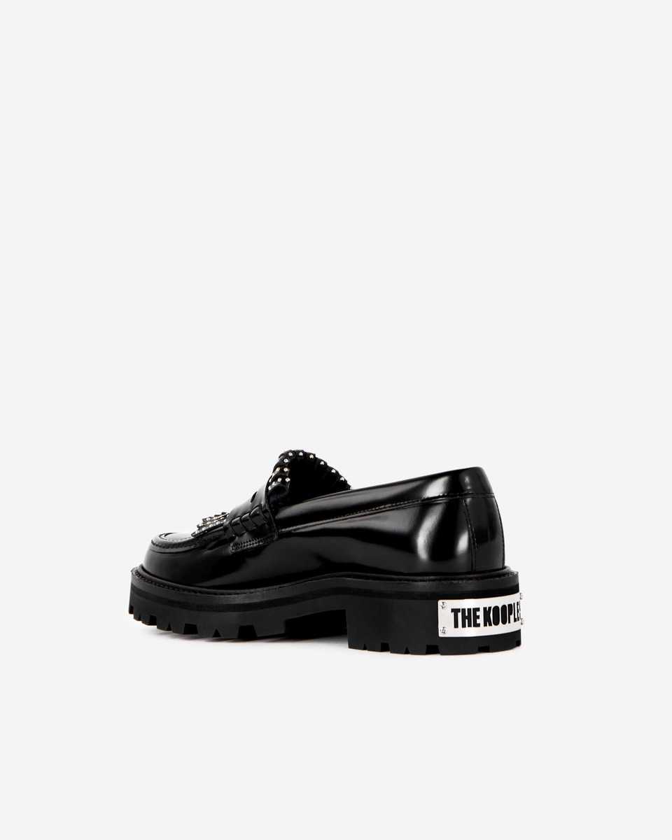 Penny loafers in black leather with fringes and studs