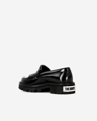 Penny loafers in black leather with fringes and studs