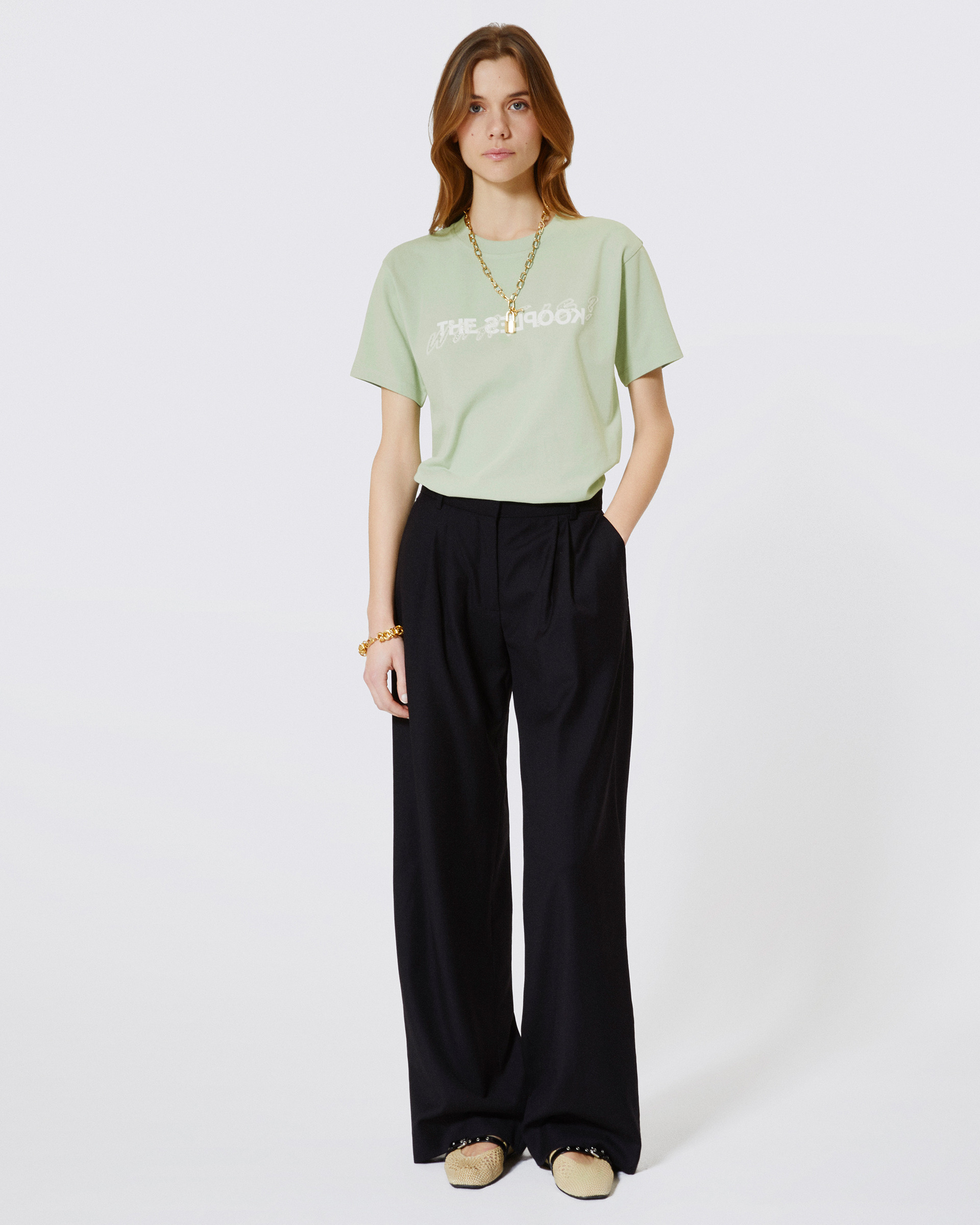 'What Is' T-shirt with green rhinestones