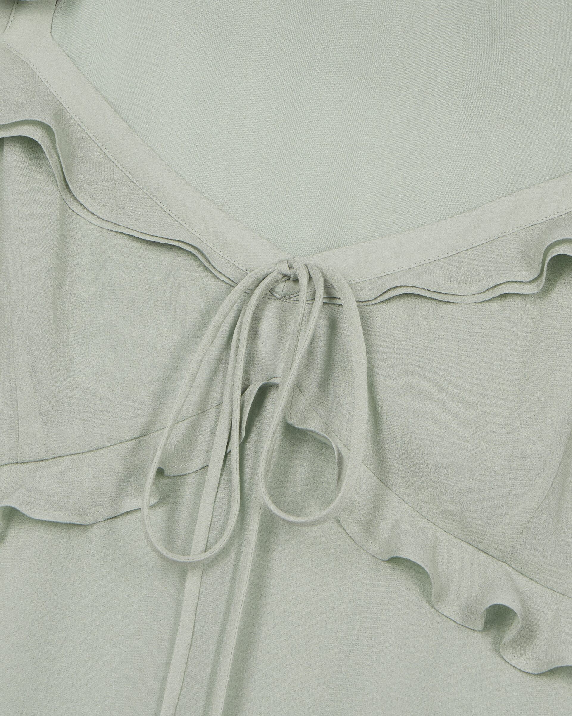 Green ruffled top