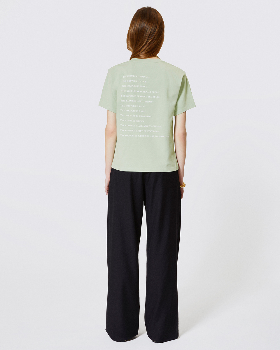 'What Is' T-shirt with green rhinestones